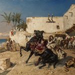 Cavalier dressant son cheval devant un fondouk au Maroc